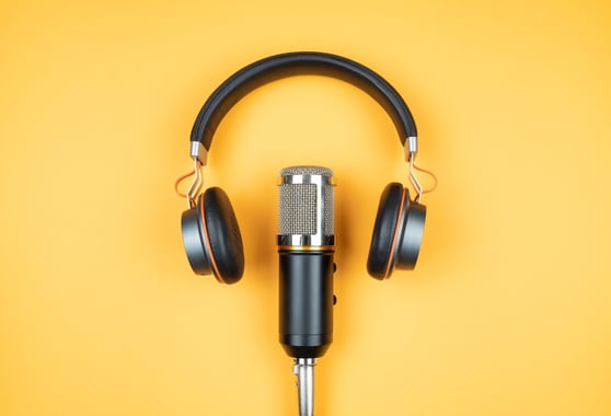 Microshope and headset on a yellow background.