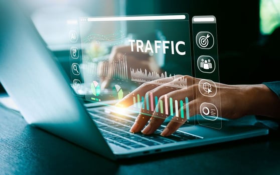 Person typing on a laptop, with a traffic report overlay.