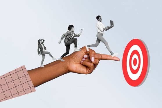 Hand pointing at a bullseye, with images of people walking along the arm