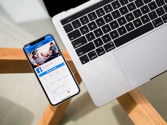 Cell phone with Facebook open on the screen.